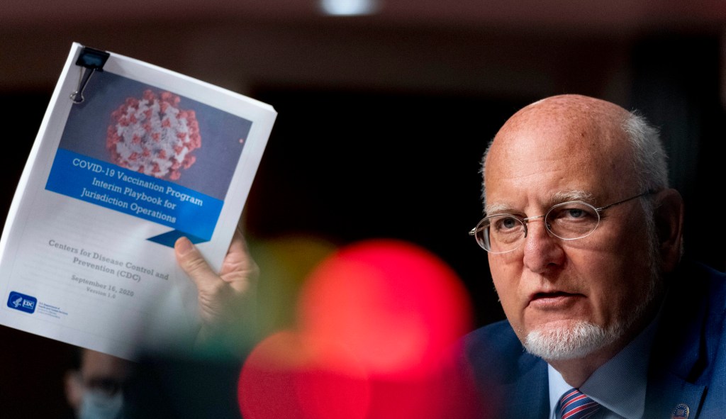 Vaccine won't help return to 'regular life' until mid- to late-2021, CDC director says